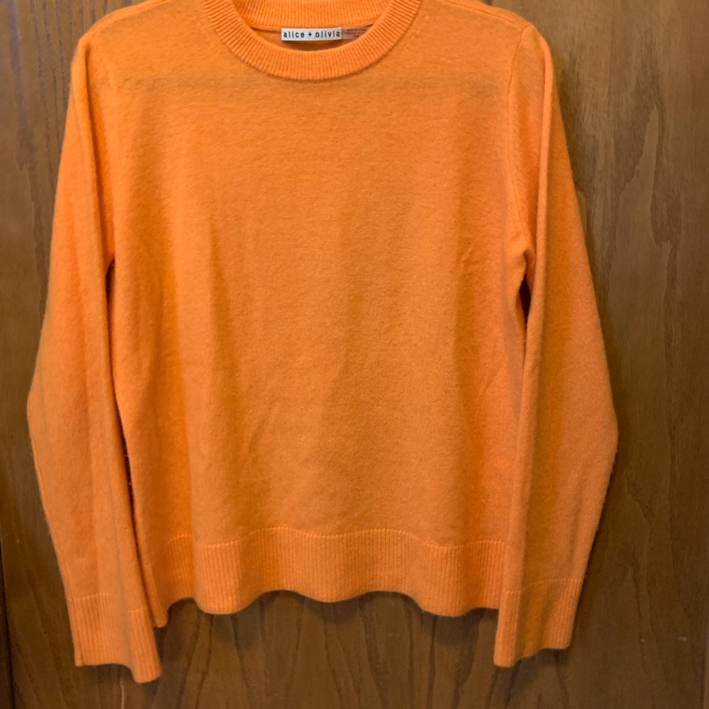 Alice and Olivia cashmere sweater. Orange size Medium. Great used condition.